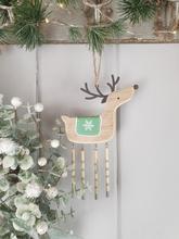 Wooden reindeer with snow flake decoration